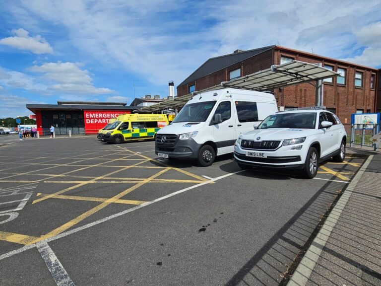 mental health transport vehicles outside a hospital